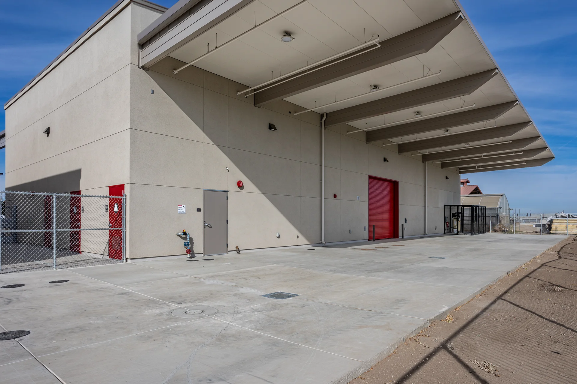 Commercial Facility Exterior with Steel Canopy and Concrete Apron