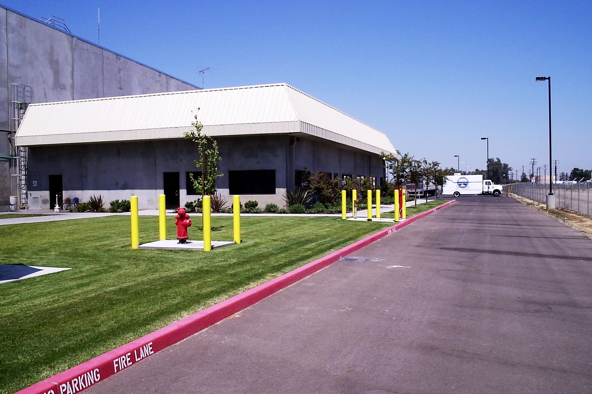 Office entrance and landscaped exterior of the Foster Farms National Chicken Distribution Center adjacent to the warehouse and distribution facility.