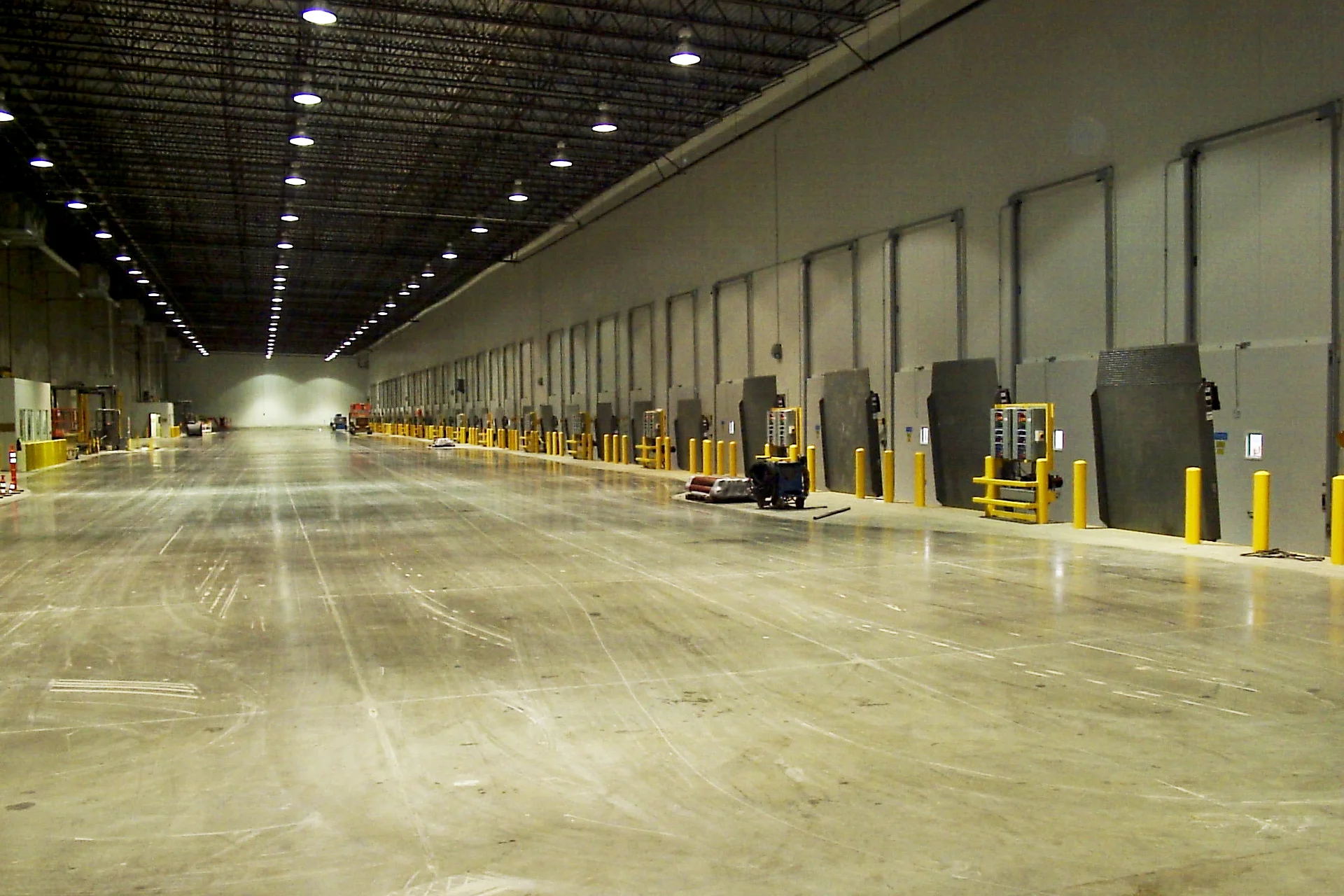 Interior of the Foster Farms National Chicken Distribution Center featuring warehouse loading bays, dock doors, polished concrete floors, and industrial distribution equipment.