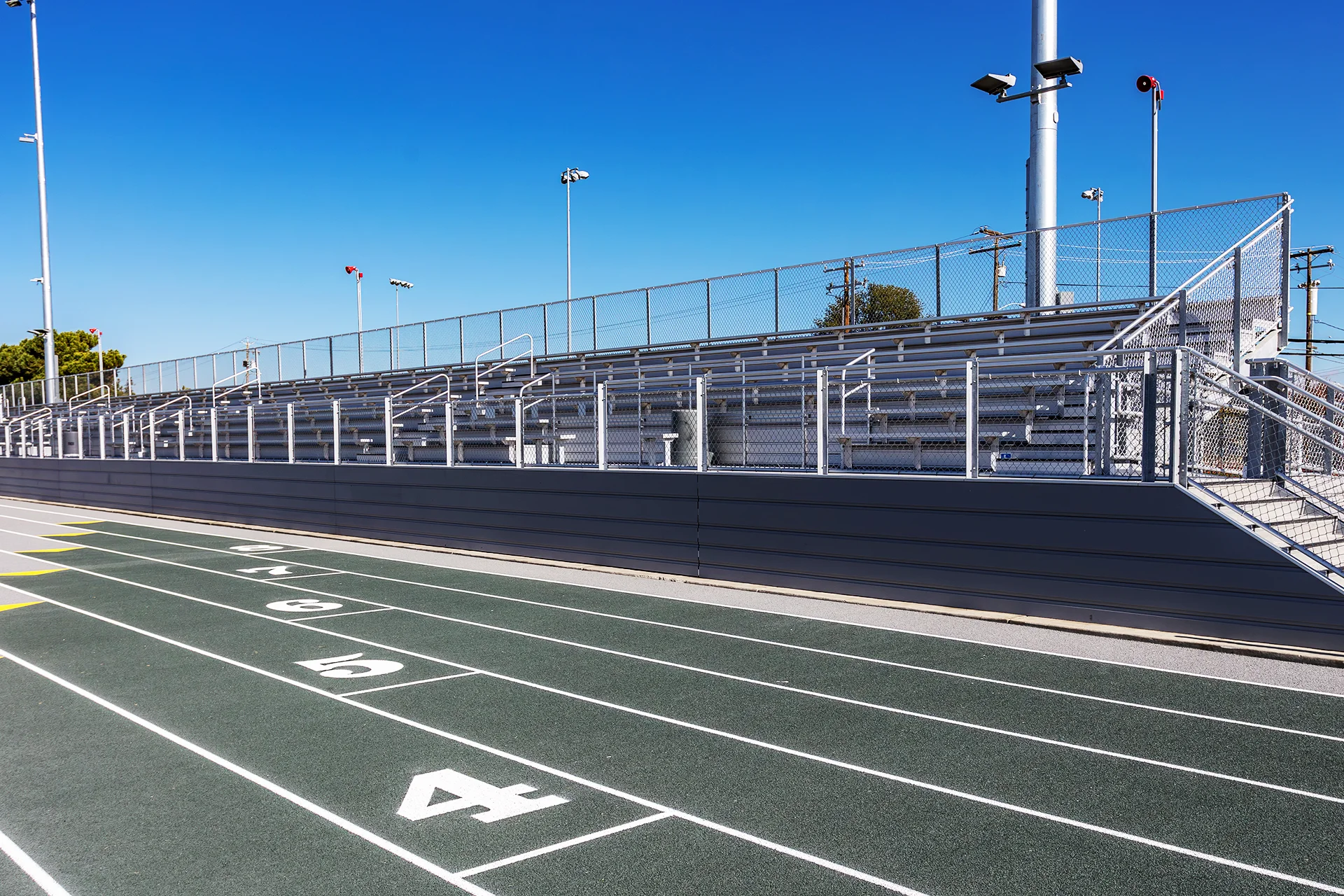 Running track lanes and renovated spectator bleachers at Manteca High School’s athletic complex.