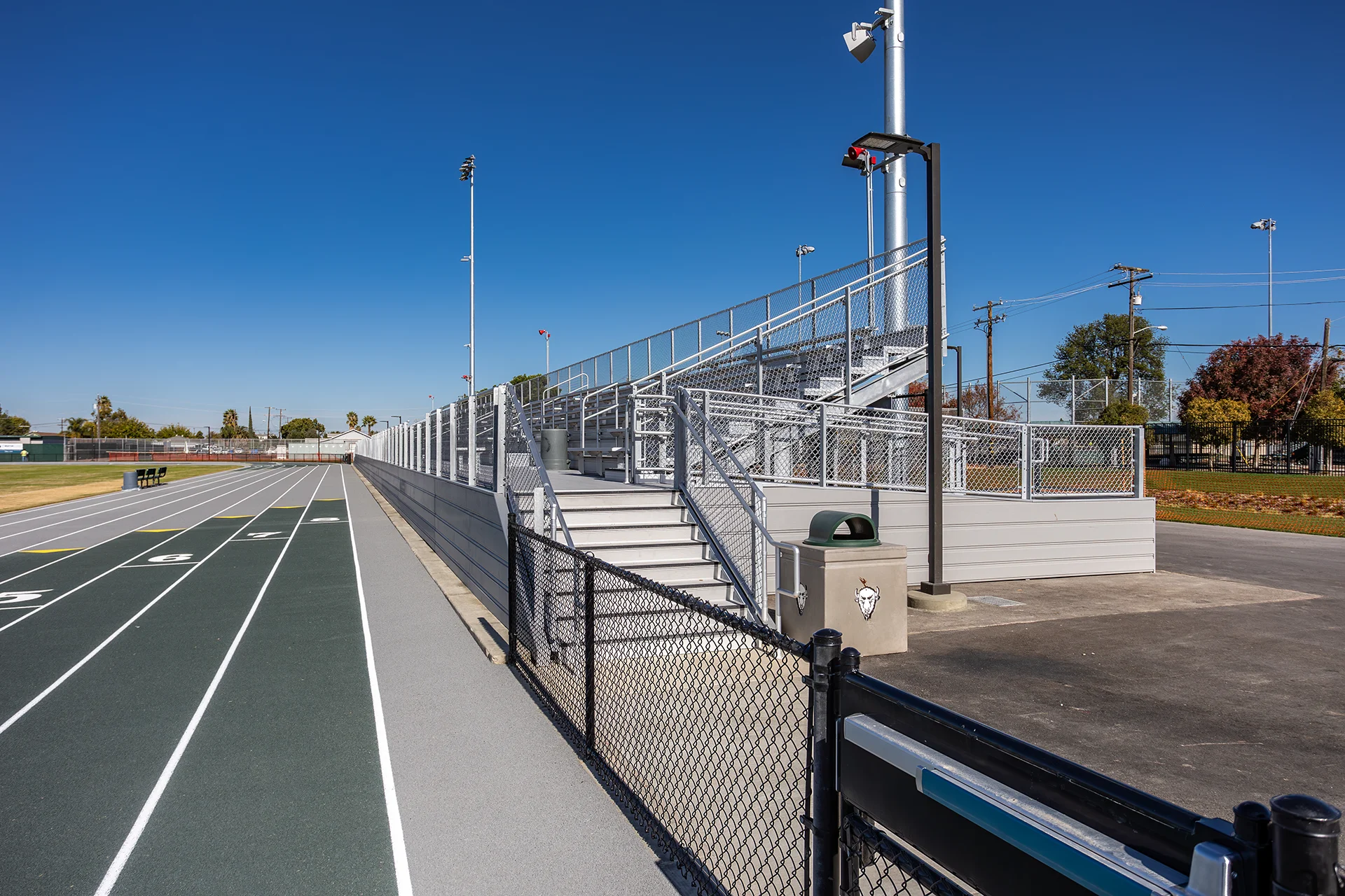 Upgraded running track, accessible stadium seating, and spectator amenities at Manteca High School’s athletic facility.