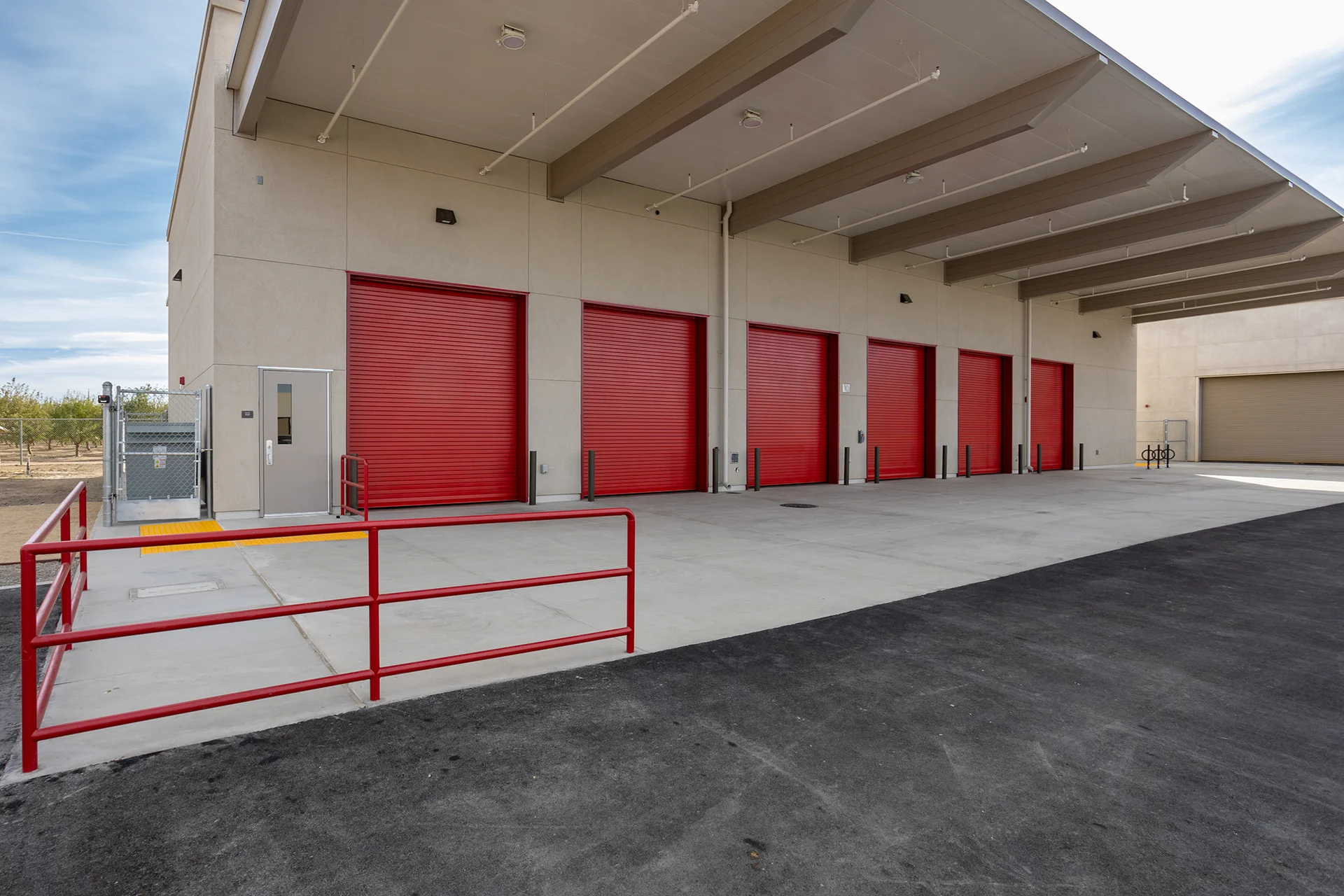 Modern Industrial Building Exterior with Canopy and Loading Bays