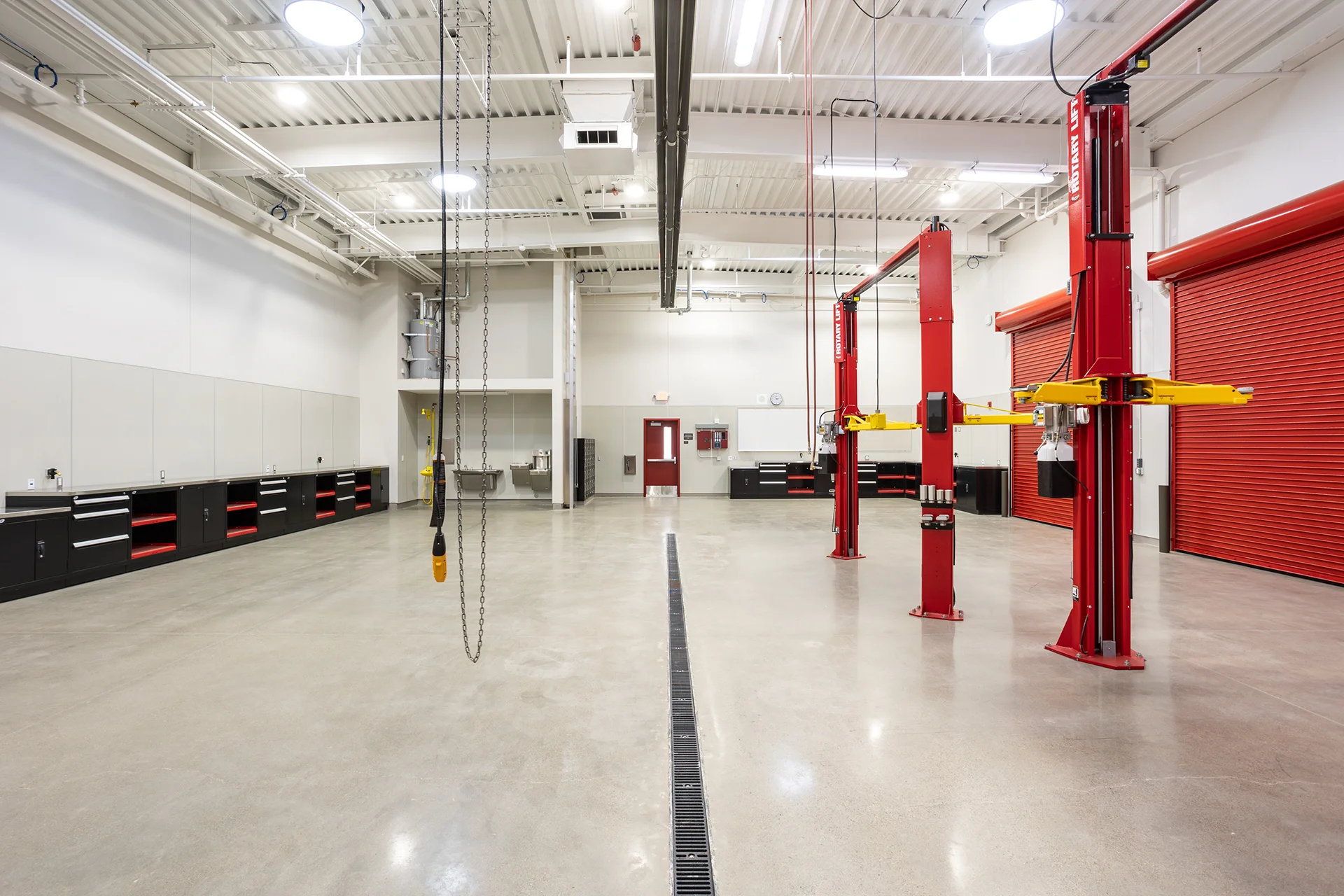 Professional Vehicle Maintenance Workshop with Built-In Cabinetry