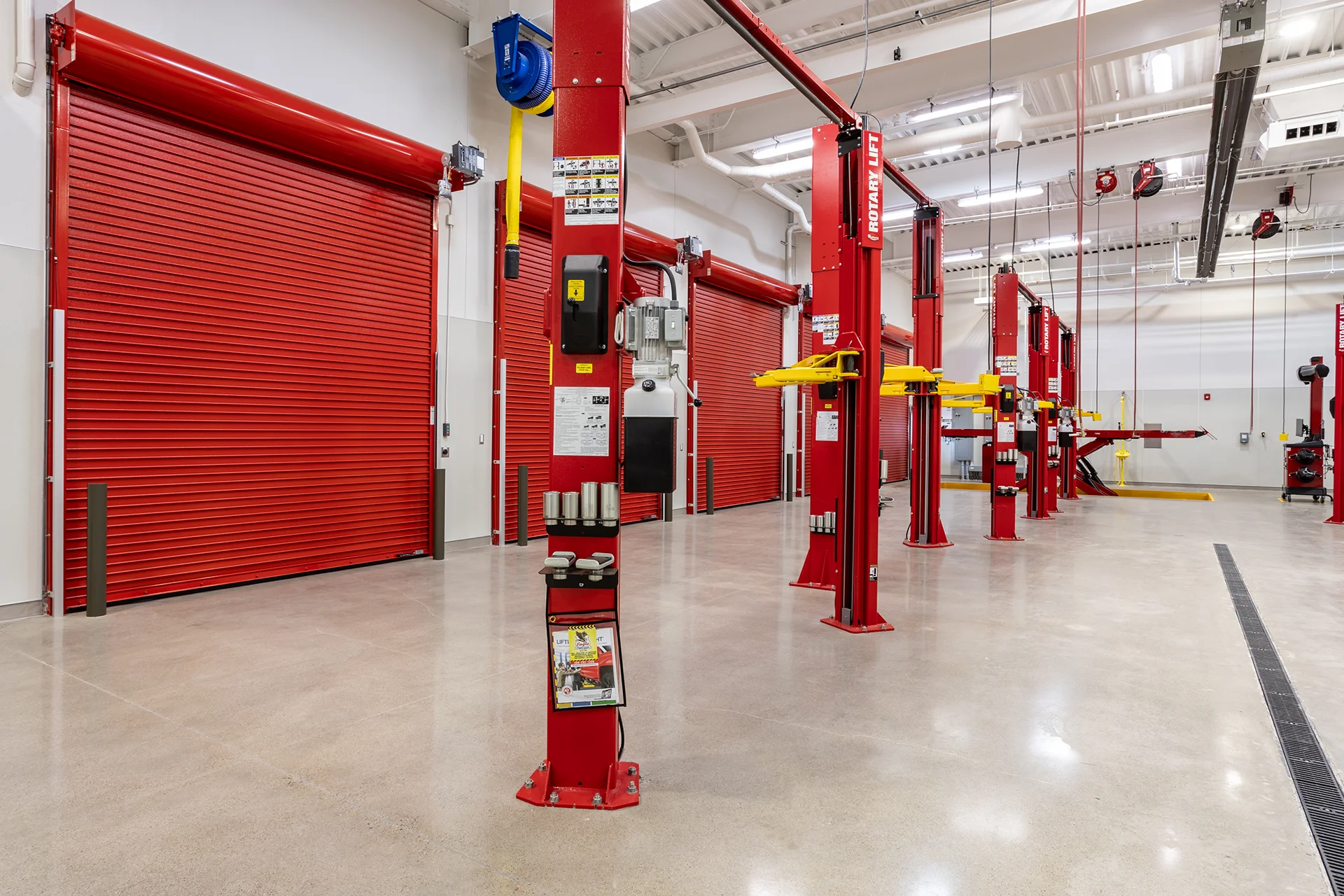 Service Bay Lineup with Overhead Fluid and Air Reels
