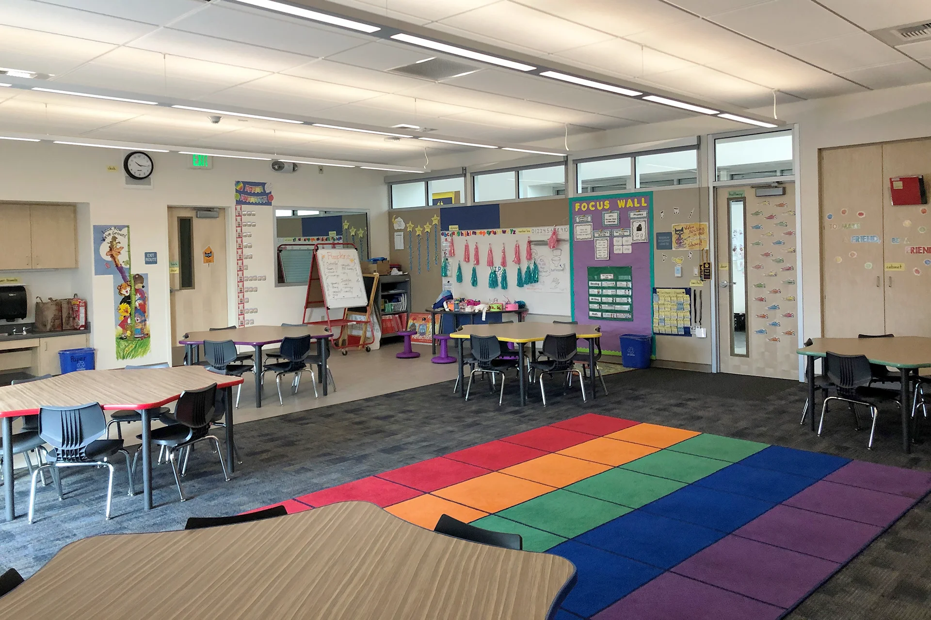 Modern classroom at K.I. Jones Elementary School featuring collaborative student tables, colorful learning spaces, educational displays, and flexible elementary classroom design.