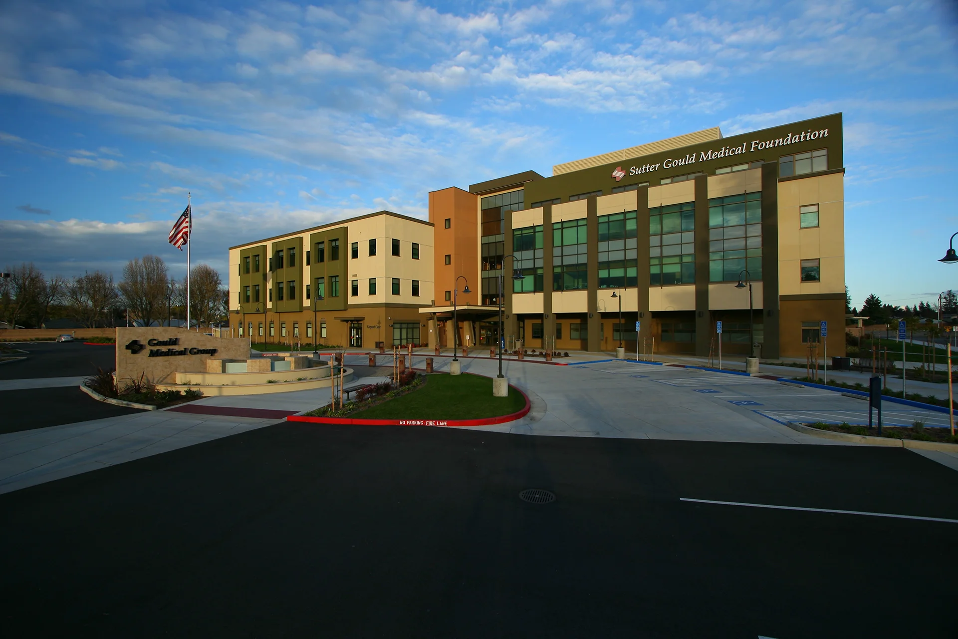Wide exterior view of the Sutter Gould Medical Foundation healthcare campus at 600 Coffee Road featuring the medical office building, patient entrance, landscaped grounds, and visitor parking.